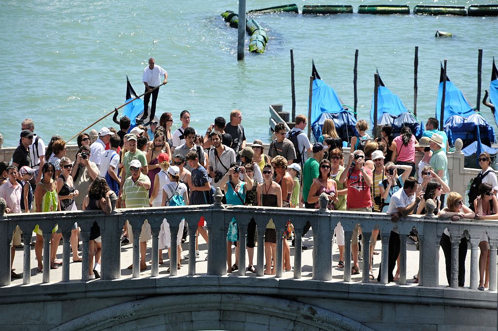 Sustainable tourism? Tourists on the Ponte della Paglia bridge, Venice.