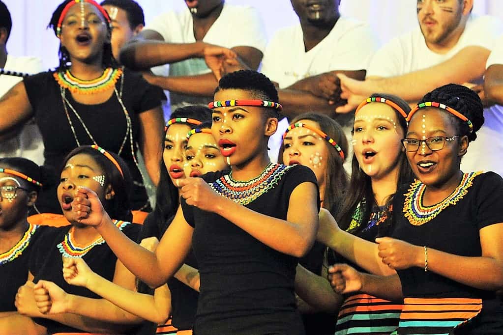 South Africa tourism minister raised racism at tourism month launch. Meanwhile, the many races of South Africa are represented in the Nelson Mandela University Choir. Source: GovernmentZA https://www.flickr.com/photos/governmentza/35872724332/