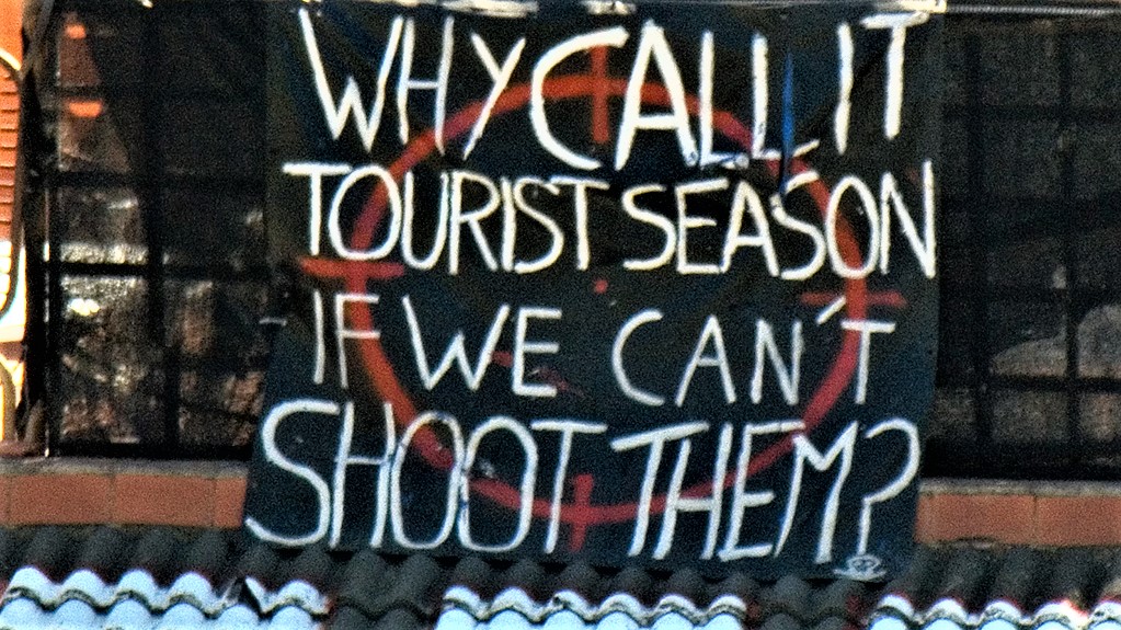 Featured image: Why call it tourist season if we can't shoot them? By David Blaikie (CC BY 2.0) via Flickr. https://www.flickr.com/photos/nikonvscanon/1463378771/ "GT" cropped and enhanced it.