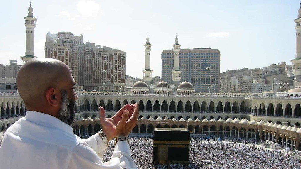 Pilgrim in supplication at the Sacred Mosque, Mecca, Saudi Arabia