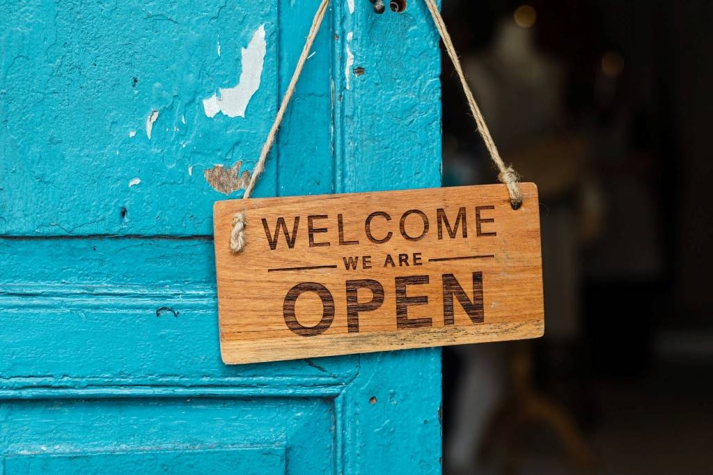 Welcome. We are open. By Ketut Subiyanto (CC0) via Pexels. https://www.pexels.com/photo/wooden-welcome-signage-4473400/