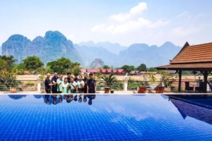 Silver Naga Vang Vieng Laos staff at the pool with a view