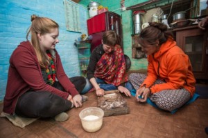 Travellers cooking with Host at Panauti Community Homestay in Nepal