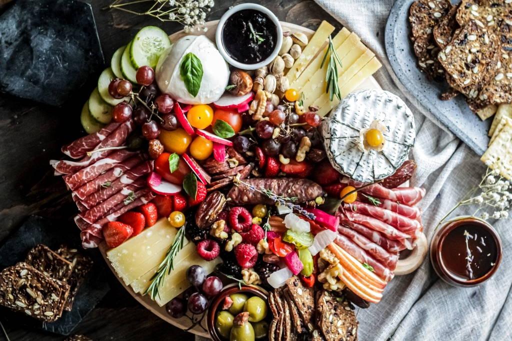 “Good news in travel & tourism” wraps up a month of “Good Tourism” & “GT” Travel news, insights, tips, and advice. Share it as you would a cheese and charcuterie platter. Photo by Anto Meneghini (CC0) via Unsplash. https://unsplash.com/photos/YiaDJAjD1S0