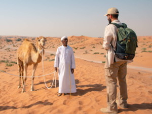 Ras Al Khaimah arab guide with camel. Source: Ras Al Khaimah Tourism Development Authority.
