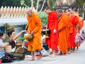Almsgiving in Luang Prabang, Laos. By Daniel Marchal (CC0) via Unsplash. https://unsplash.com/photos/f2d6hc6gVco